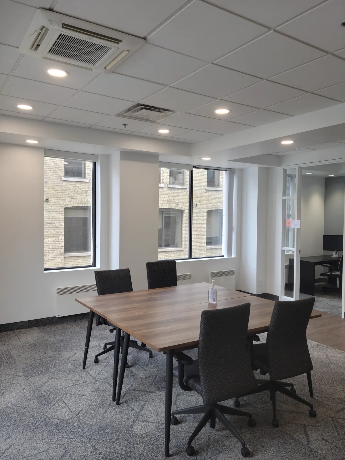 Finished commercial office lighting in a reception area.
